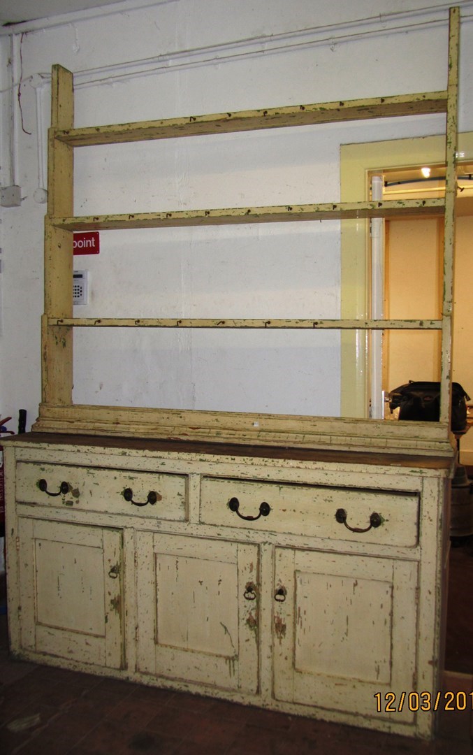 Appraisal: A Victorian painted pine dresser with open plate rack over