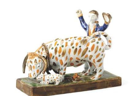 Appraisal: STAFFORDSHIRE PEARLWARE BULL-BAITING GROUP CIRCA Modeled with a tethered bull