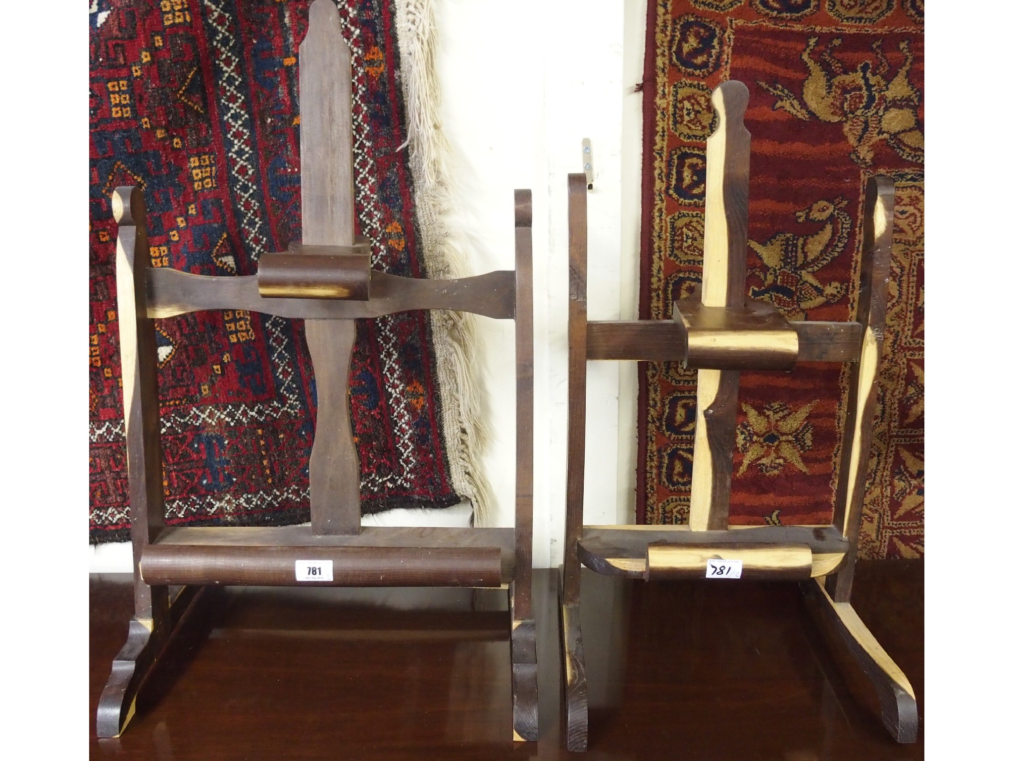 Appraisal: Two dark stained wooden display easels