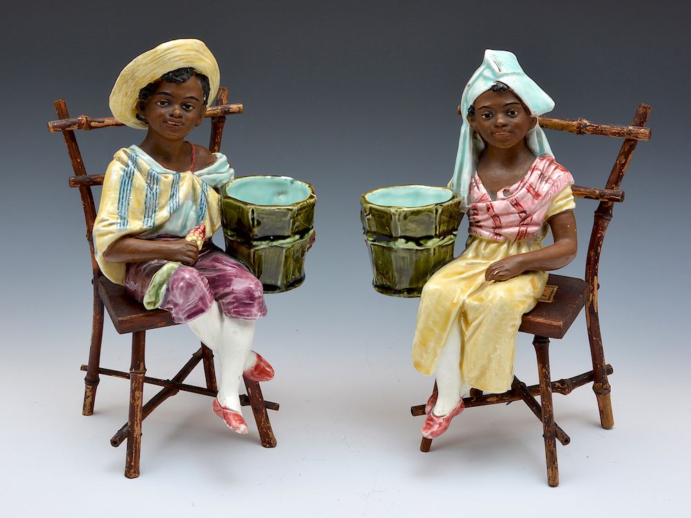 Appraisal: Pair of seated West Indies figures on chairs Pair of