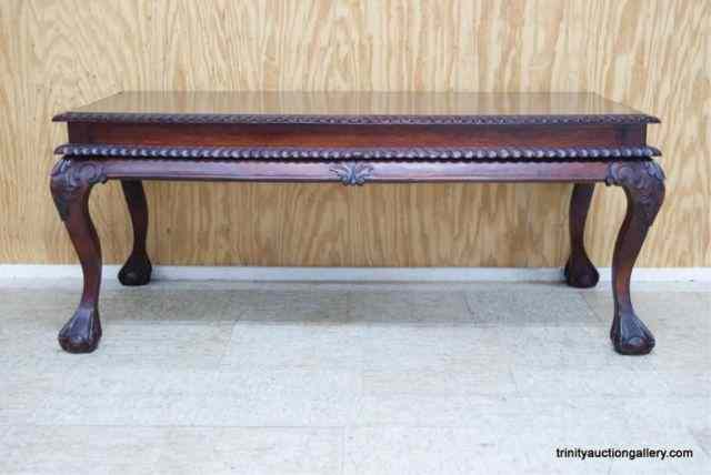 Appraisal: Carved Mahogany Claw Foot Coffee TableIs nicely detailed with a