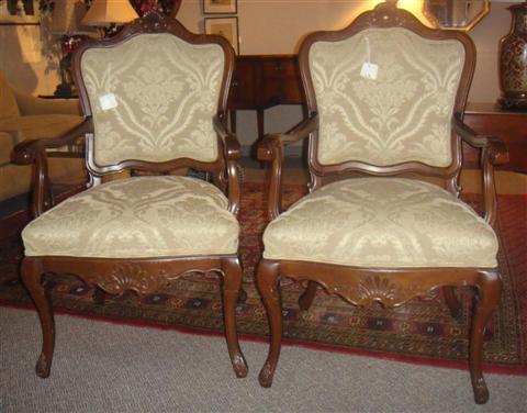 Appraisal: PAIR OF ROCOCO STYLE ARM CHAIRS WITH TOFFEE COLORED UPHOLSTERY