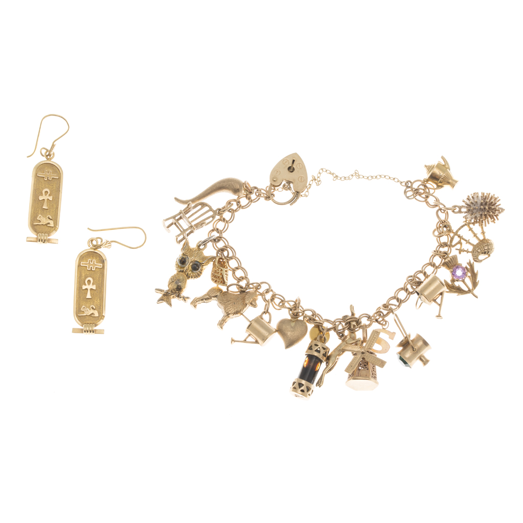 Appraisal: A ct gold charm bracelet composed of double curb links