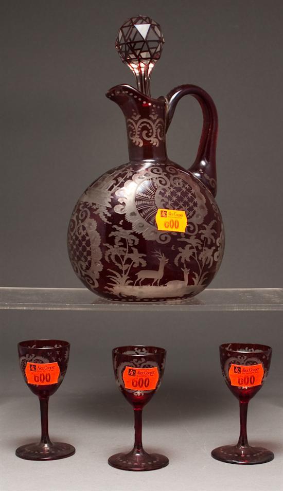 Appraisal: Bohemian ruby etched-to-clear glass decanter with three matching cordials early