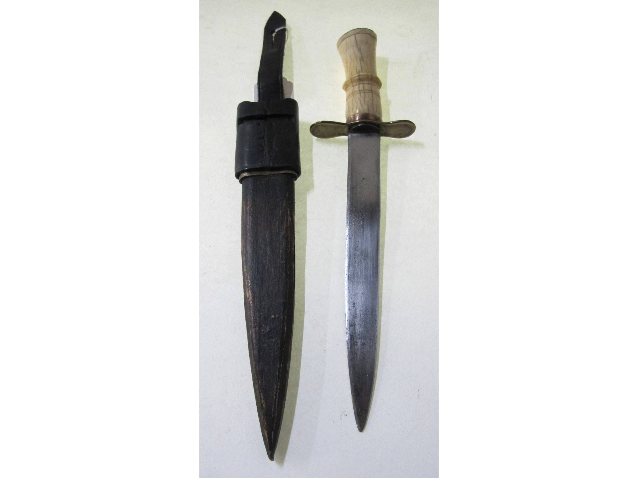 Appraisal: A French ivory handled Bowie style knife in scabbard