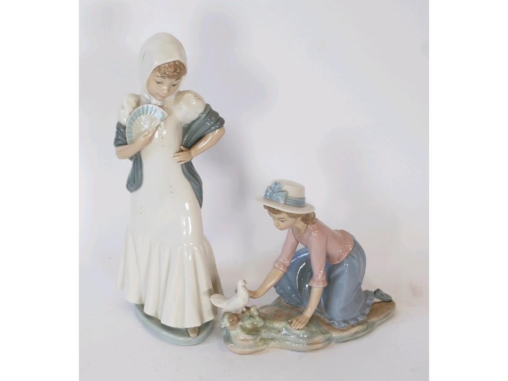 Appraisal: TWO NAO PORCELAIN FIGURES OF YOUNG LADY'S one modelled with