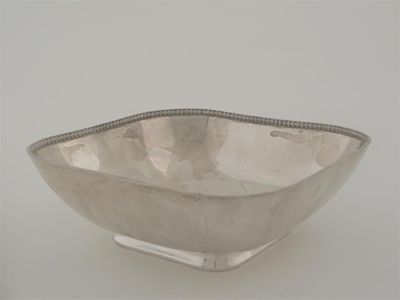 Appraisal: A modern square dish with a gadrooned rim and a