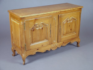 Appraisal: A French provincial pine sideboard th century with shaped panelled