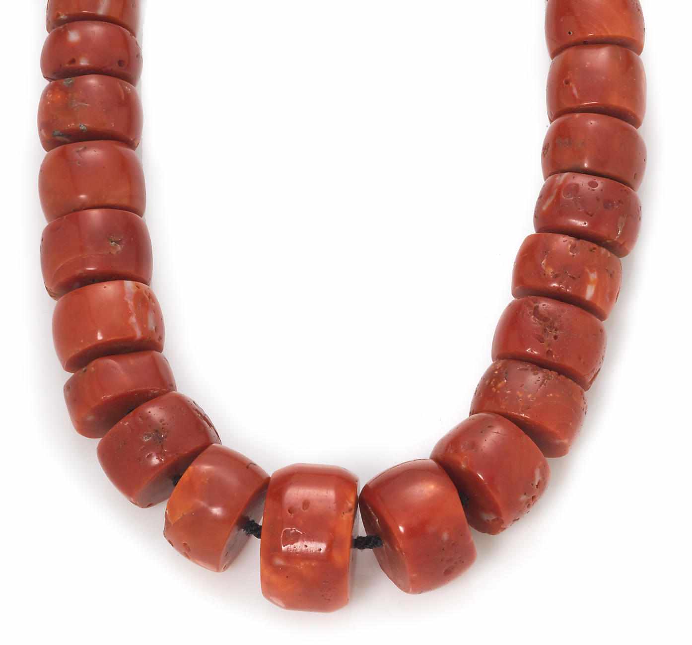 Appraisal: A coral bead graduated endless necklace composed of coral beads