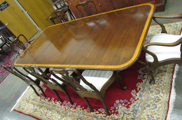 Appraisal: Mahogany dining room group with banded mahogany -section triple pedestal