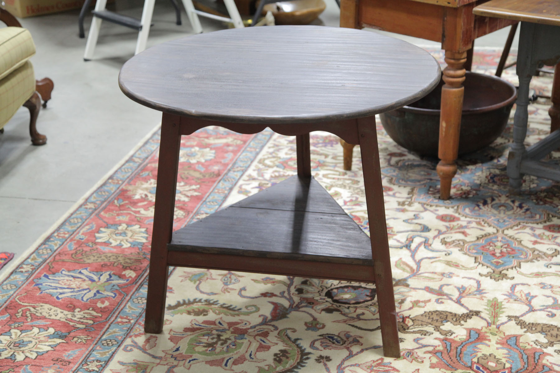 Appraisal: REPRODUCTION CRICKET TABLE American th century Poplar table with black