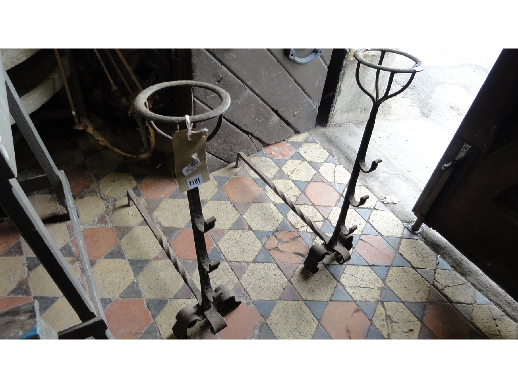 Appraisal: A pair of old English style ironwork andirons with open