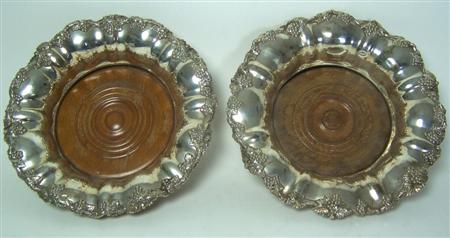 Appraisal: A pair of sheffield plated wine coasters with everted scalloped