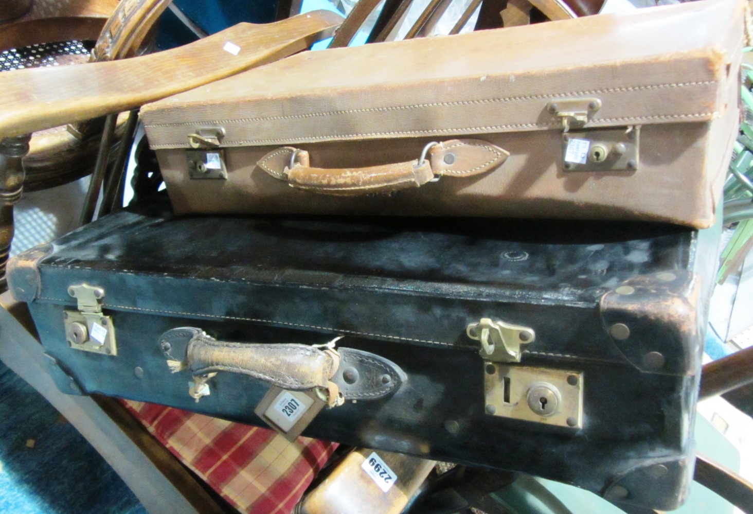 Appraisal: A black leather suitcase and another suitcase