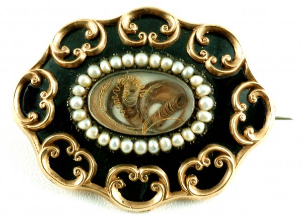 Appraisal: Victorian mourning pendant brooch Approx K yellow gold scrolled frame