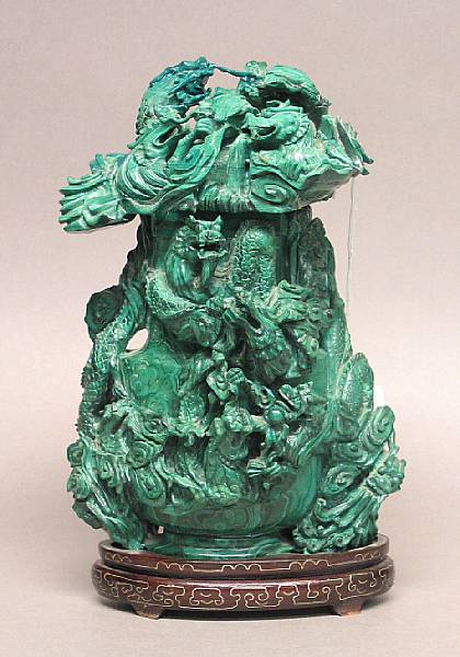 Appraisal: A carved malachite covered vase The vase of flattened baluster