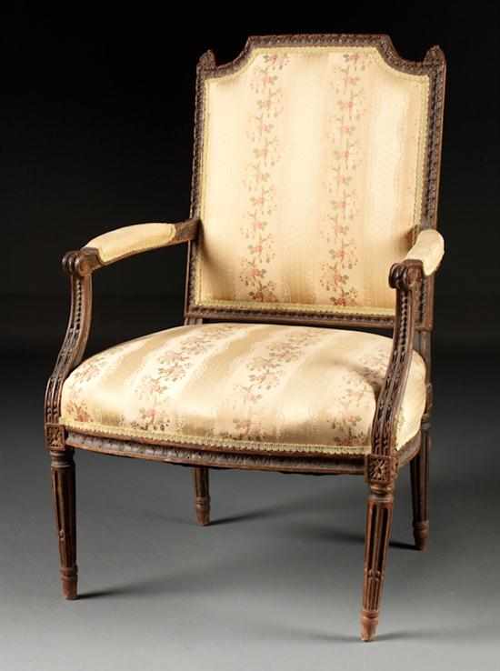 Appraisal: Louis XVI style carved and painted wood silk upholstered fauteuil