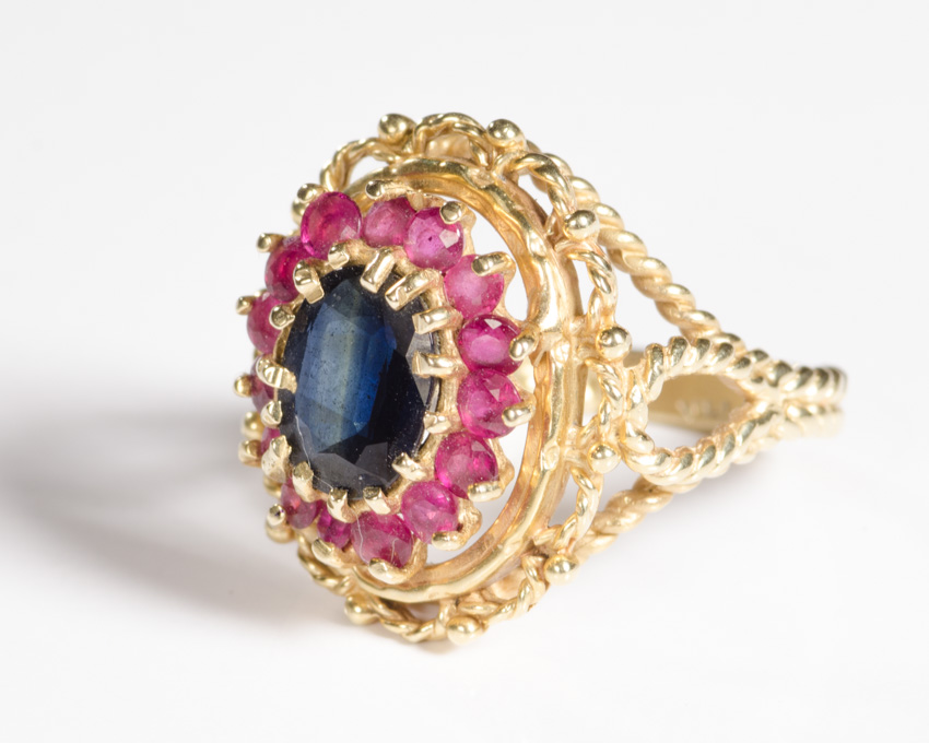 Appraisal: SAPPHIRE RUBY AND FOURTEEN KARAT GOLD RING with round-cut rubies