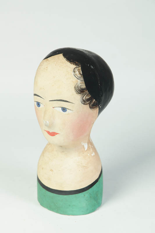 Appraisal: MILLINER'S HEAD France th century Composition head of a woman