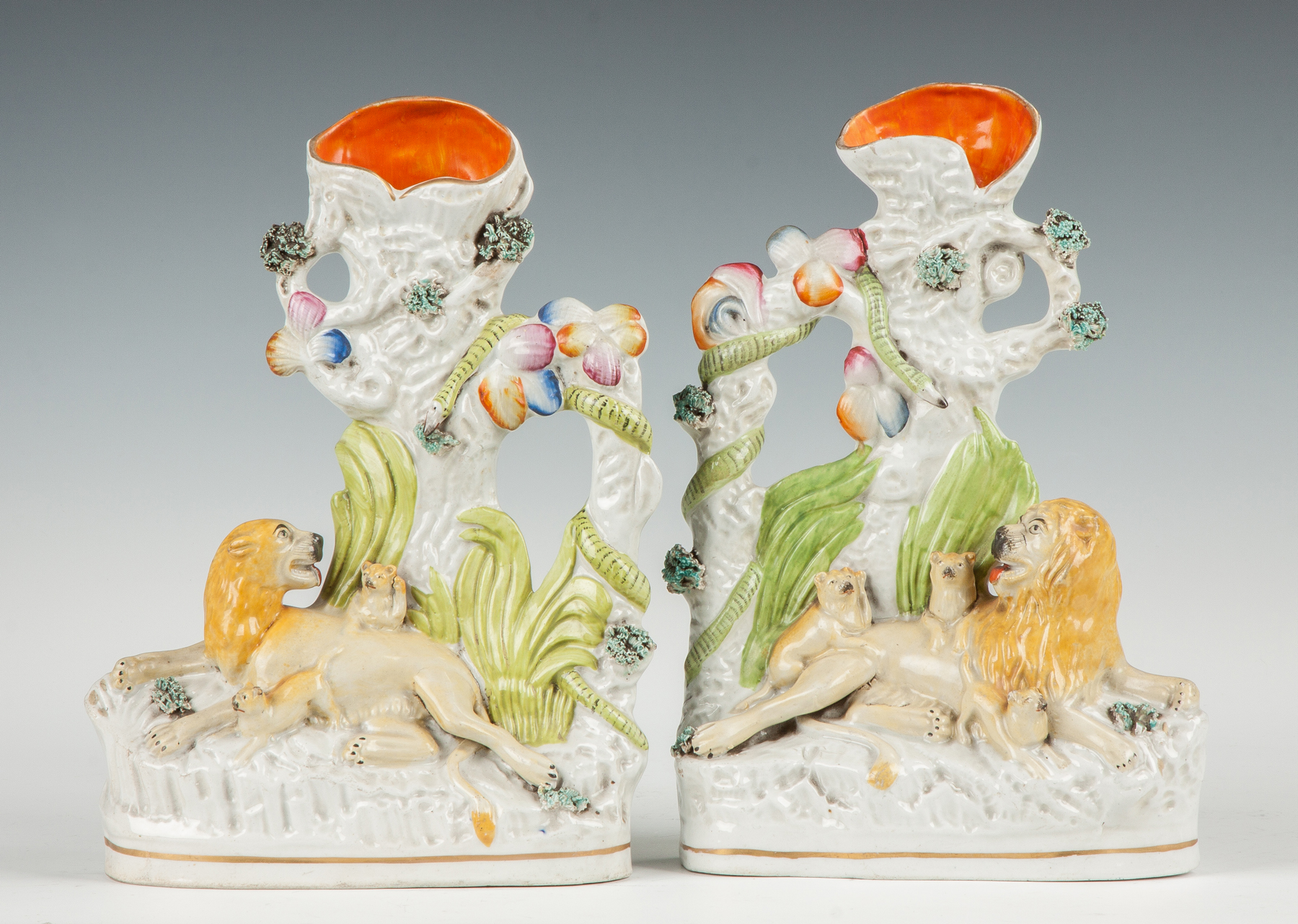 Appraisal: Pair of Staffordshire Spill Vases th cent With lion lioness