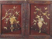 Appraisal: A pair of Japanese carved ivory on board panels of