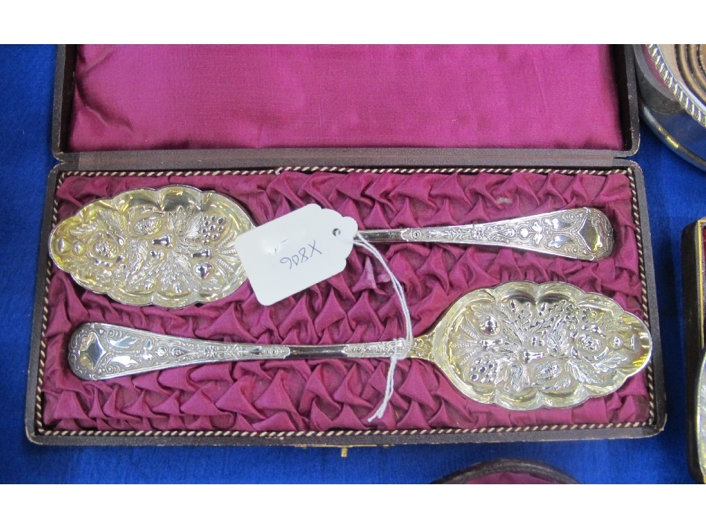 Appraisal: A cased pair of silver plated berry spoons