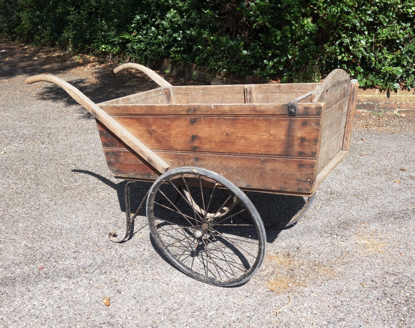 Appraisal: A vintage two wheeled wooden cart