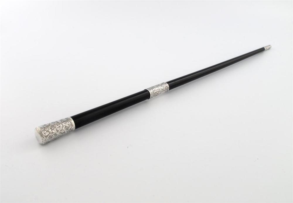 Appraisal: An Edwardian silver mounted ebony conductor s baton