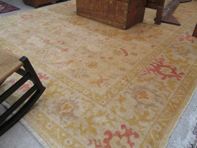 Appraisal: HAND KNOTTED ORIENTAL CARPET Western Anatolia Oushak design Pakistani weavers