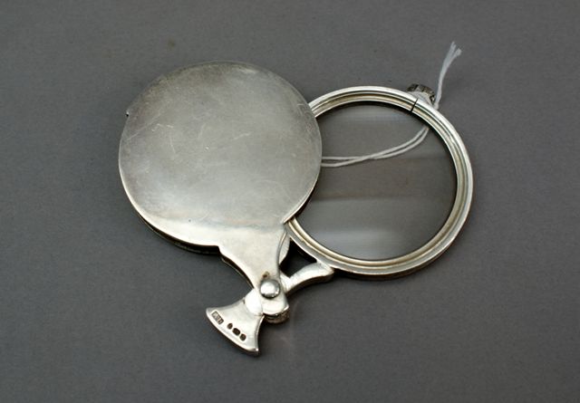 Appraisal: A sterling silver circular magnifying glass and case in classic