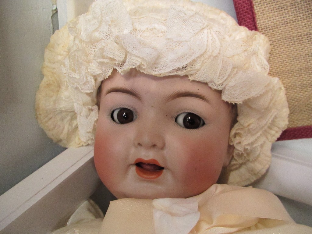 Appraisal: A bisque headed doll by Simon Halbeg 'Flirting Eyes' No