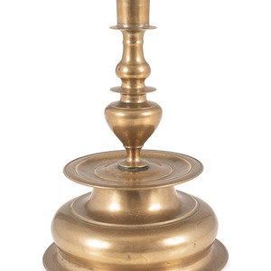 Appraisal: A Rare Continental Brass Bell-Bottom Candlestick Likely Nuremberg Circa marked