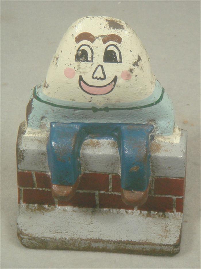 Appraisal: Cast iron doorstop Humpty Dumpy figure on sitting on brick