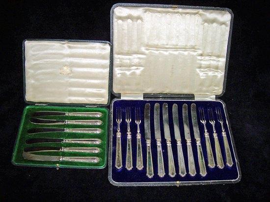 Appraisal: Six pairs of dessert knives and forks with silver filled