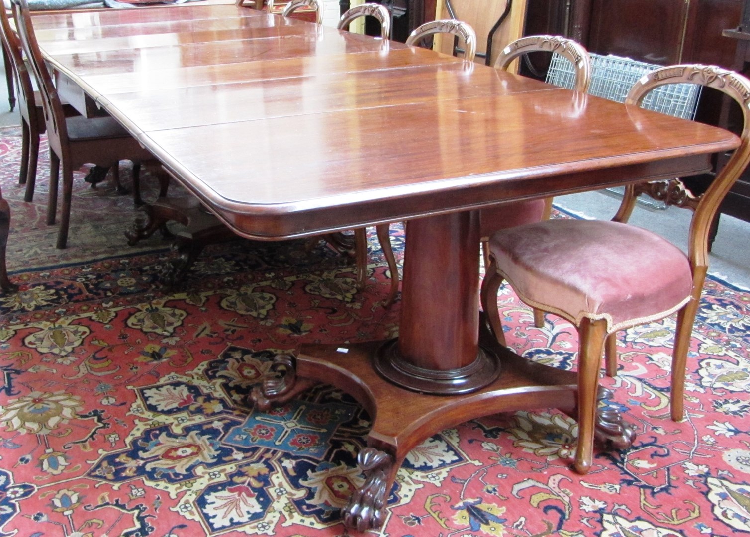 Appraisal: A th century mahogany triple section extending dining table comprising