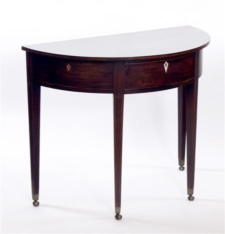 Appraisal: A George III demi-lune table with a single frieze drawer