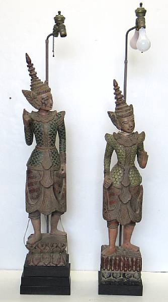 Appraisal: Two similar Thai polychrome carved wood figures fourth quarter th