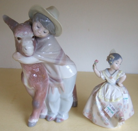 Appraisal: A Lladro figure modelled as a boy with a donkey