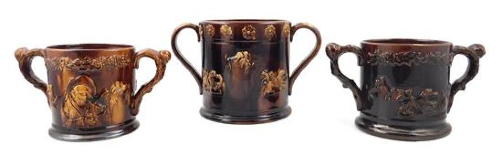 Appraisal: Three English ceramic mugs with brown glaze and two flanking