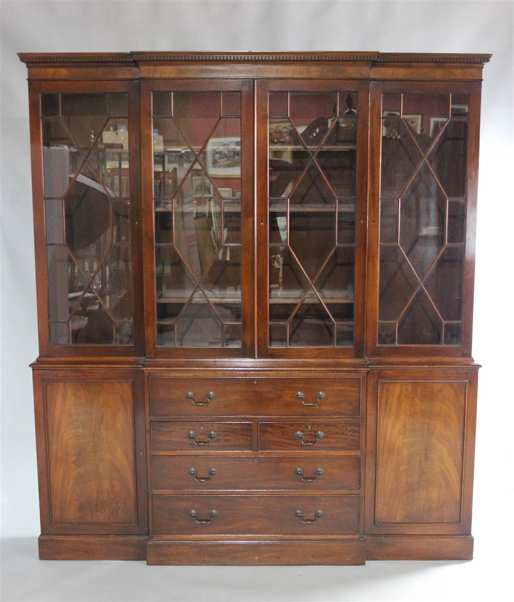 Appraisal: GEORGE III STYLE MAHOGANY BREAKFRONT of typical form in two