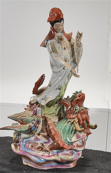 Appraisal: Chinese enameled porcelain Guanyin atop dragon with phoenix x x