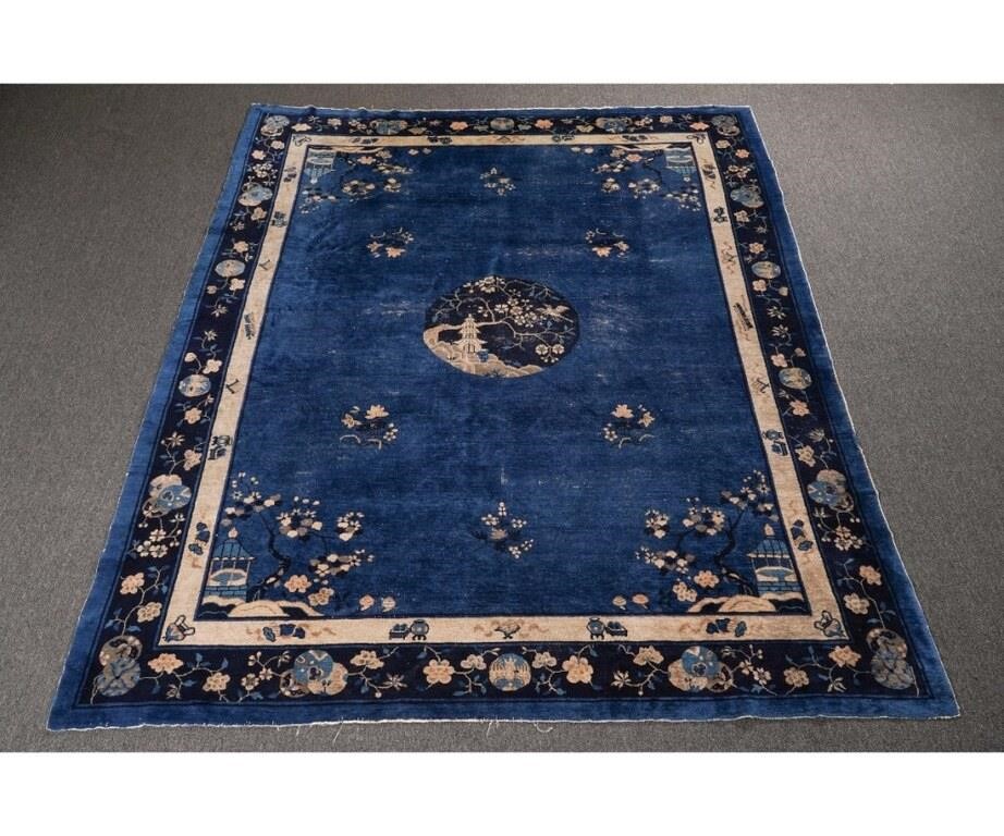 Appraisal: Chinese room size Peking carpet with blue field and floral