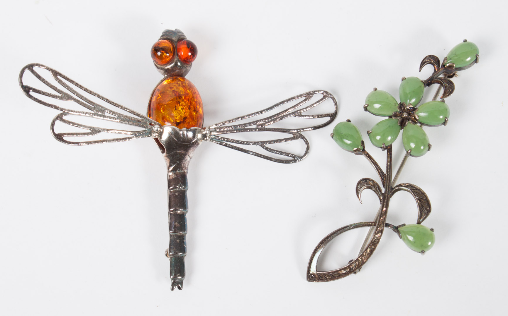 Appraisal: Amber dragonfly brooch a jade flower brooch handmade amber and