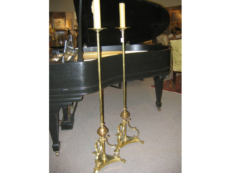 Appraisal: PAIR OF TALL BRASS CANDLESTANDS Plain circular tops with prickets