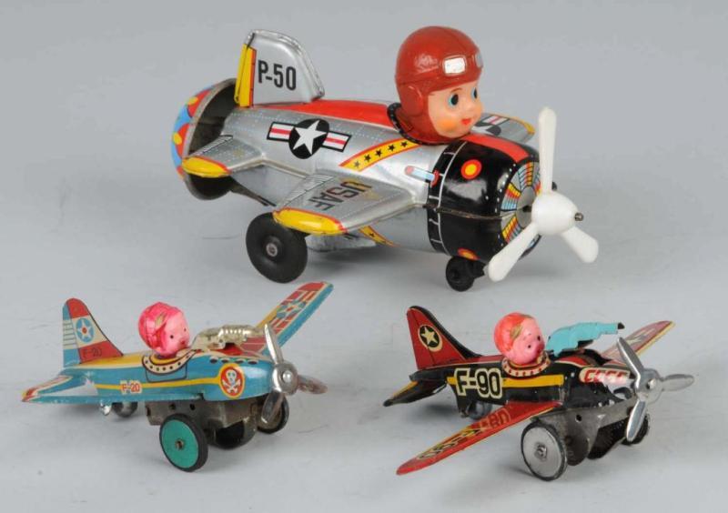 Appraisal: Lot of Tin Airplane Friction Wind-Up Toys Description Japanese Working