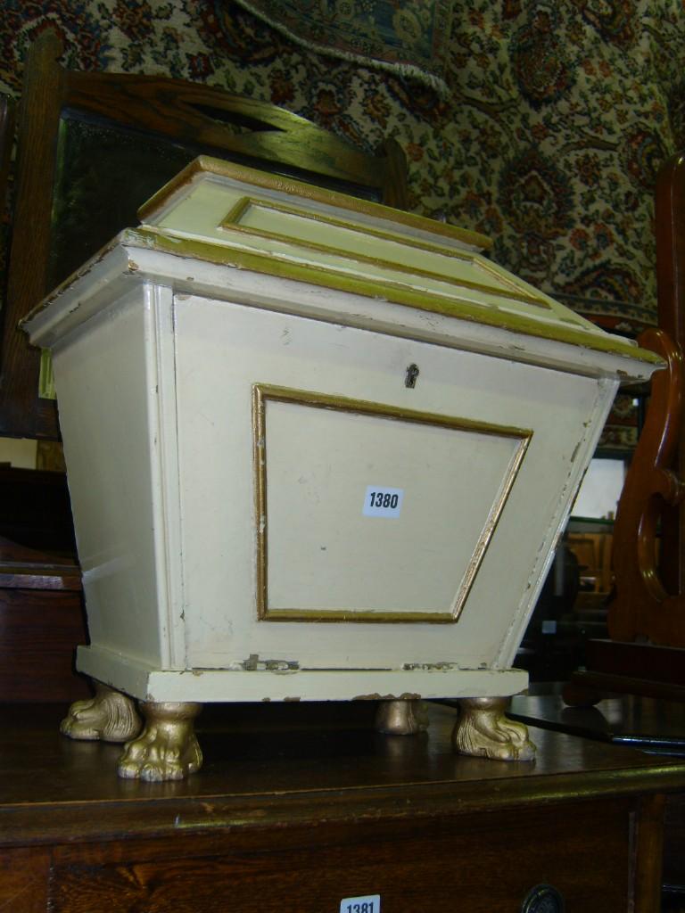 Appraisal: A sarcophagus shaped box with painted finish and drop front