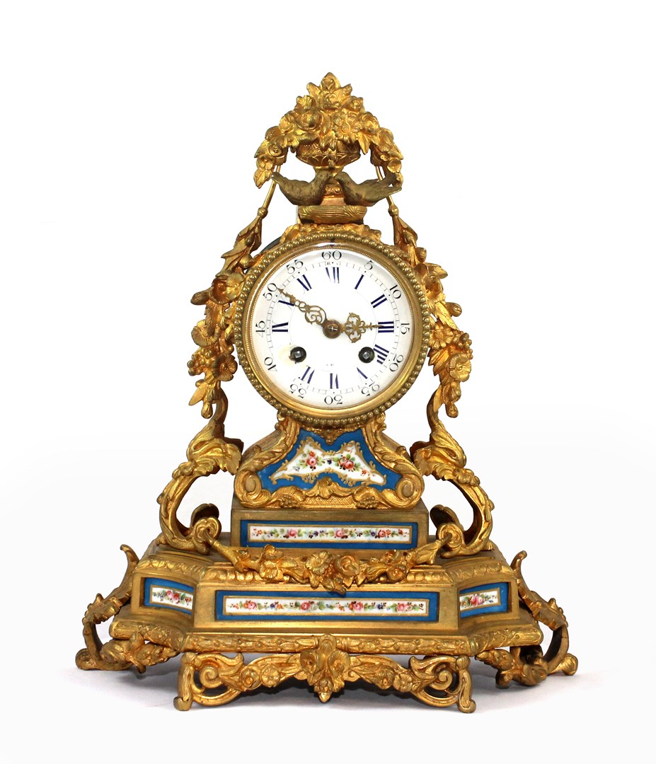 Appraisal: A French porcelain mounted gilt bronze striking mantel clock late