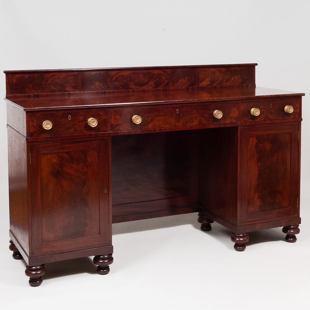 Appraisal: Regency Mahogany Sideboard Fitted with a splash board above three