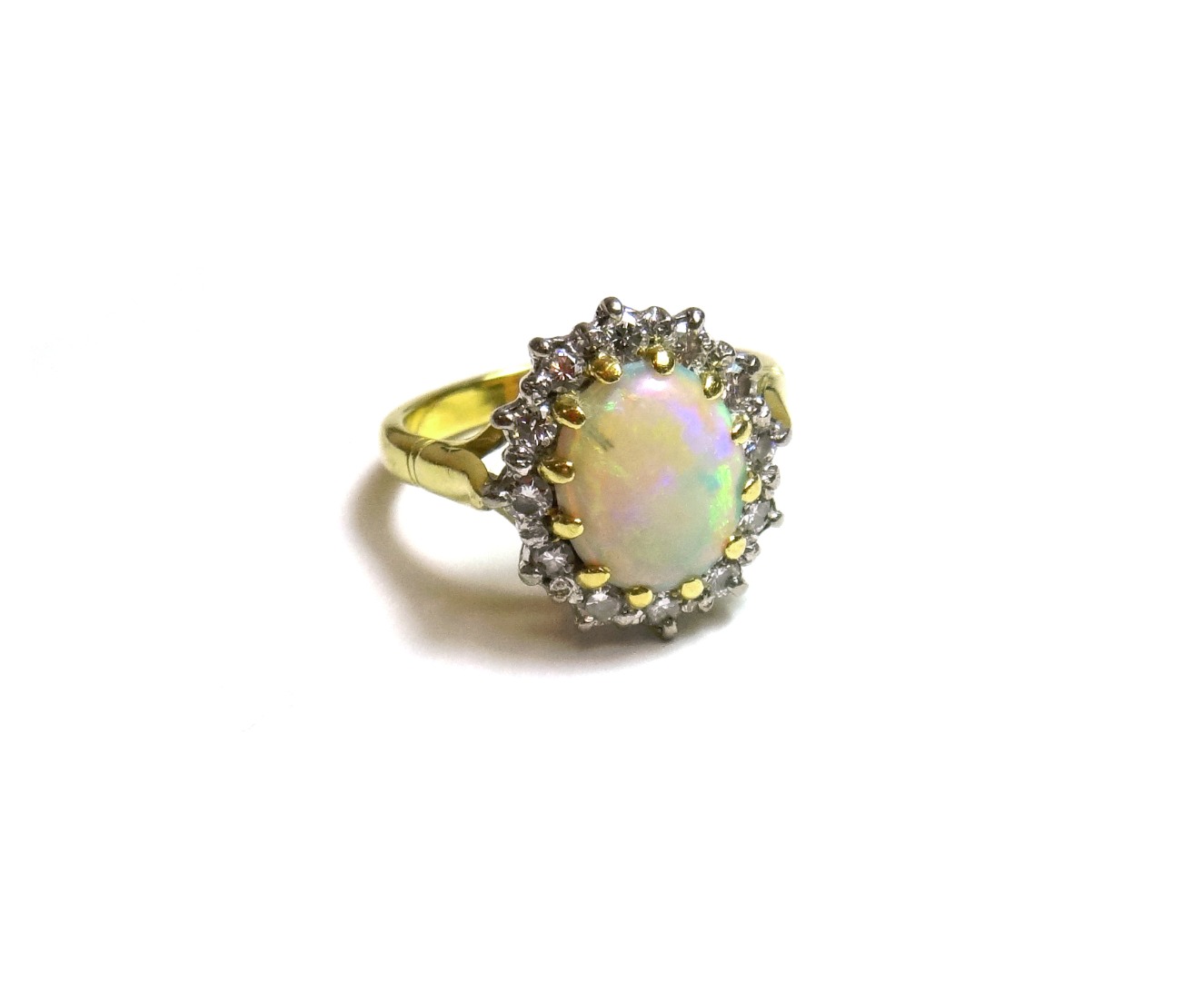 Appraisal: An ct gold opal and diamond set oval cluster ring