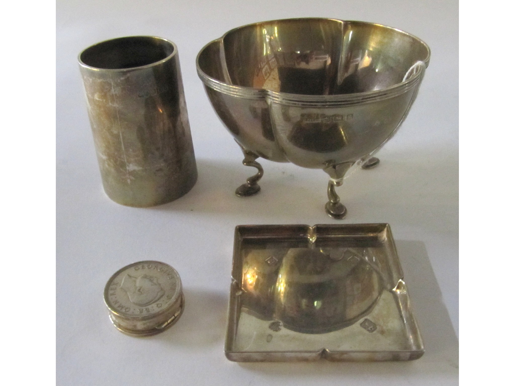 Appraisal: A lot comprising a silver beaker Sheffield a sugar bowl